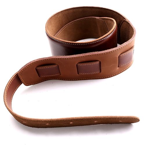 Adjustable leather guitar strap for bass, acoustic, and electric guitars.