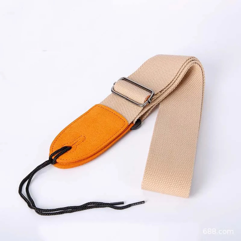 Beige-colored fabric guitar strap