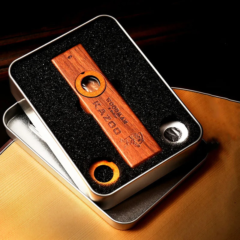 Wooden kazoo in a metal case