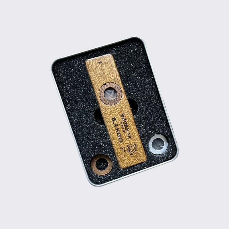 Splendid wooden Kazoo in a metal case
