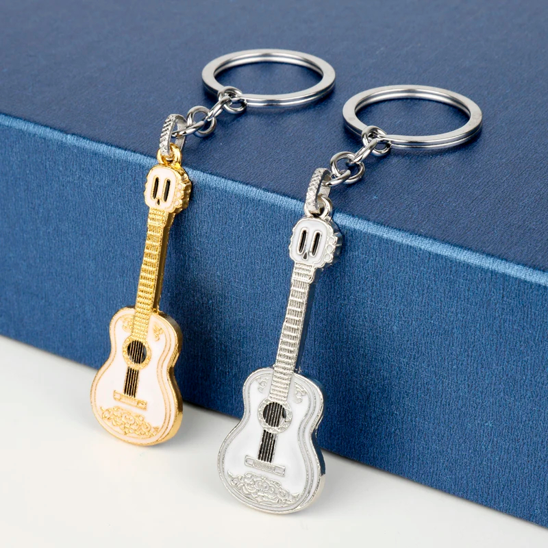 Golden or silver acoustic guitar keychain