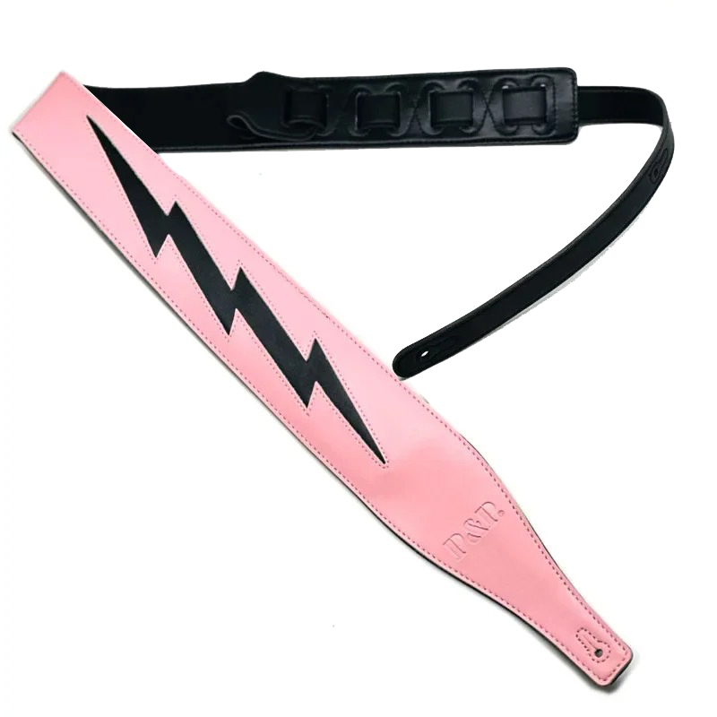 Black iconic lightning model leather guitar strap on pink background