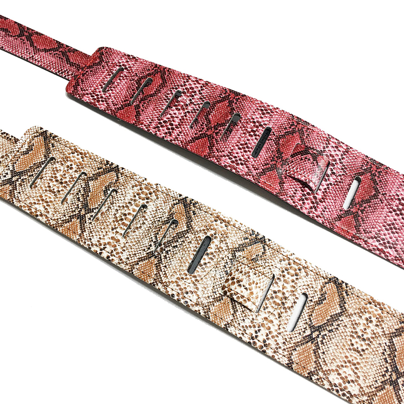 Ends of genuine leather guitar strap with snake skin pattern