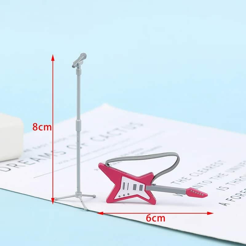 Dimensions of a pink star-shaped miniature electric guitar with microphone