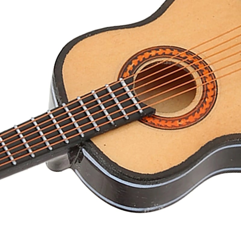 Rear view of a realistic wooden miniature acoustic guitar for hanging