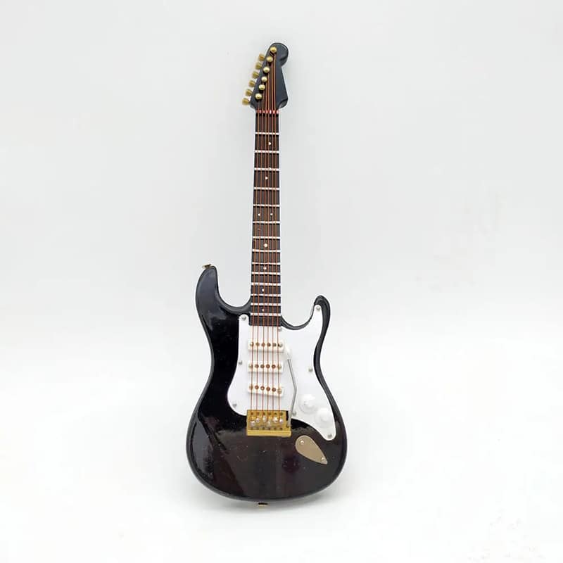 Front view of a 1-6 scale miniature electric guitar