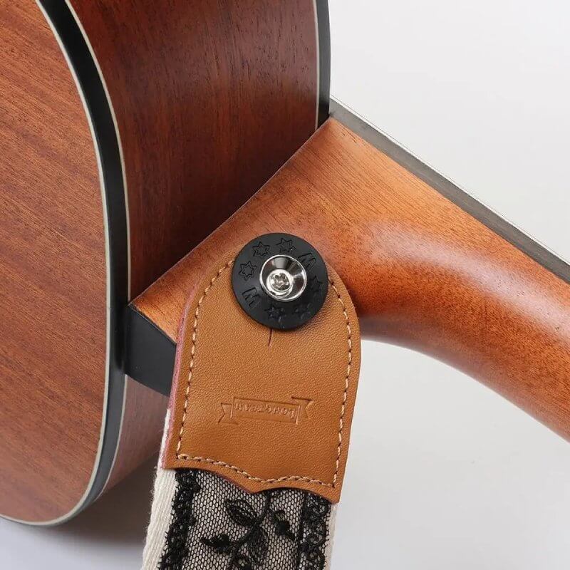 View of the fixation of the Black Floral Lace Guitar Strap