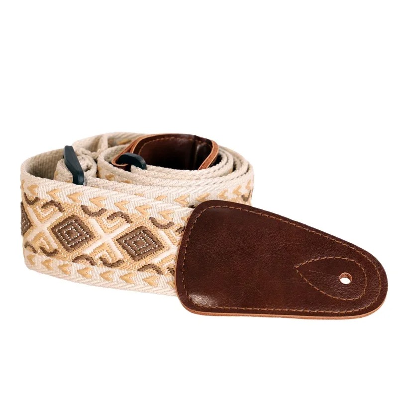 A vintage guitar strap with a sable tribal design.