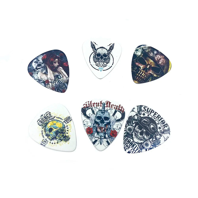 Examples of metal box picks with a set of 12 picks featuring Death Metal designs.