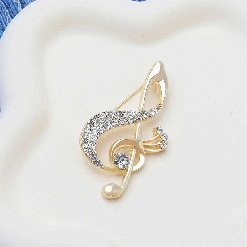 Sun-shaped Clf brooch adorned with Rhinestones