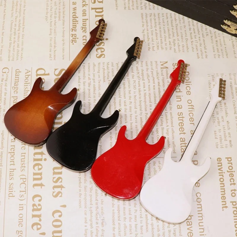 Backside of a miniature electric guitar in red or black with storage box - 4 units.