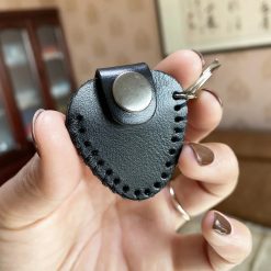 Guitar keychain made of genuine leather with a pick case