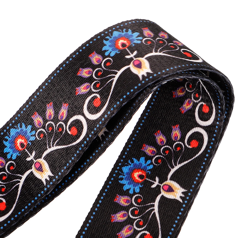 Close-up of a banjo strap with a bohemian flower design