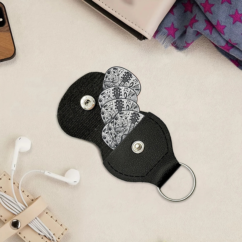 Set of 6 guitar picks in black and psychedelic black color.