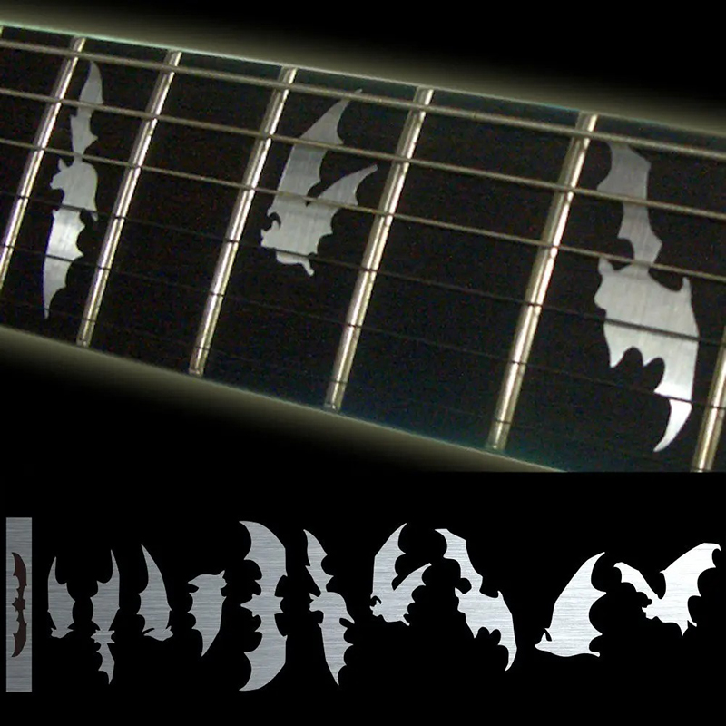 Fret markers with bat motifs