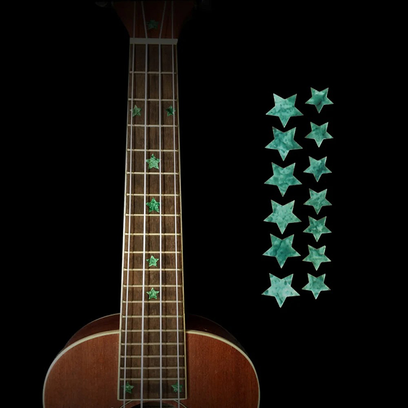 Fret markers with star motifs