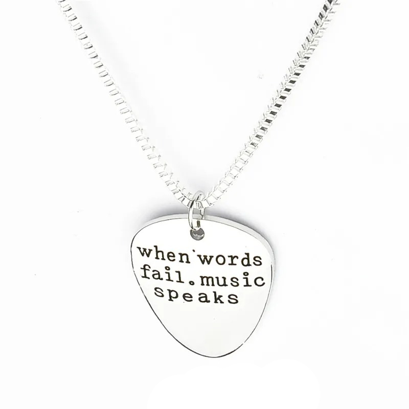Full view of the spike-shaped medallion with the words "When Words Fail, Music Speaks".