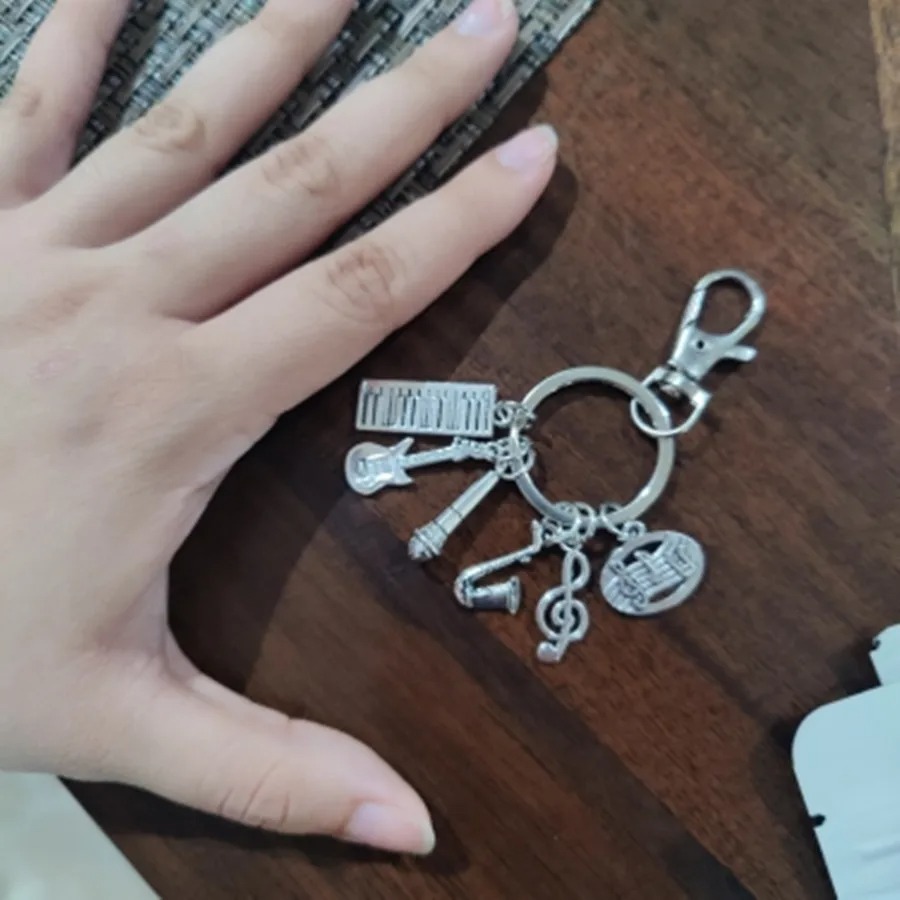 Dimensions of the Enchanted Melody guitar keychain