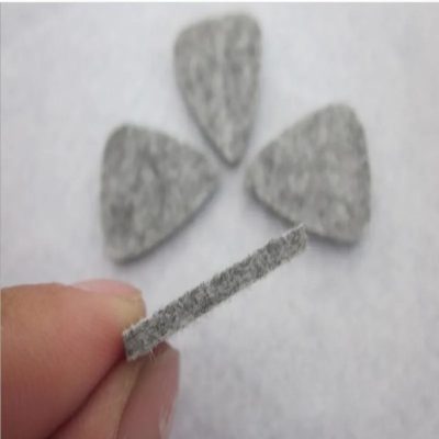 Details of a set of 4 soft felt picks in assorted colors for ukulele.