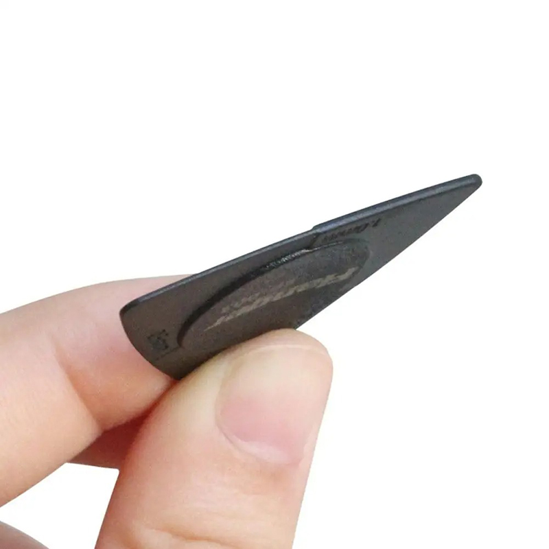 Side view of a triangular guitar pick with 3 durable and non-slip thicknesses.