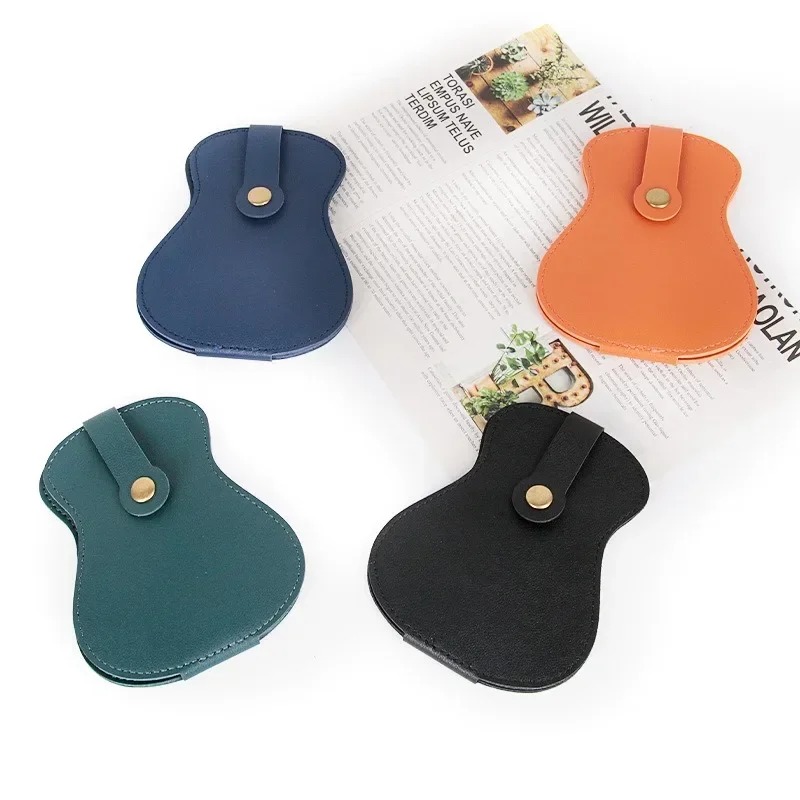 Guitar-shaped storage case for guitar picks.