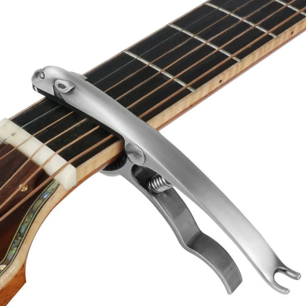 Front view of a metal capo made of zinc alloy in the shape of a steel-colored leopard.
