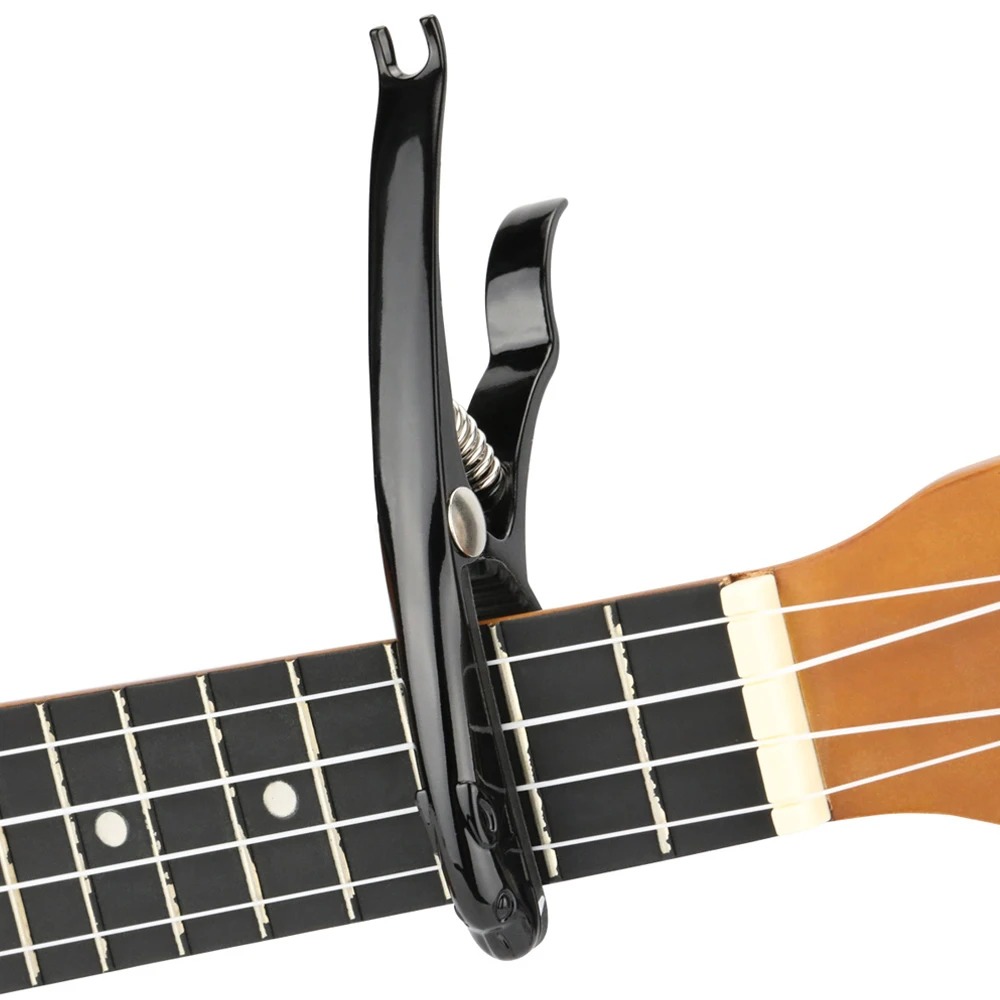 Detailed view of a metal capo made of zinc alloy in the shape of a leopard.