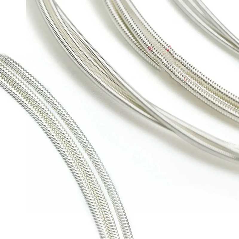 Detailed view of the strings of a concert classical guitar - Crystal nylon and carbon trebles with a full and balanced sound, comfortable to the touch.