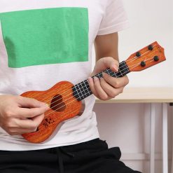 Details of the strings of a child's ukulele, a perfect instrument for toddlers.
