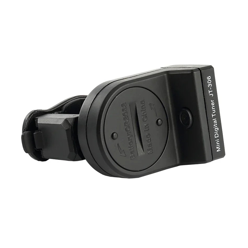 Rear view of a digital guitar tuner with an LCD screen and a clip for attachment