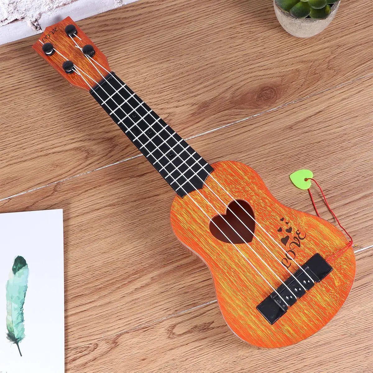 Details of the strings of the child's ukulele, a perfect instrument for toddlers.
