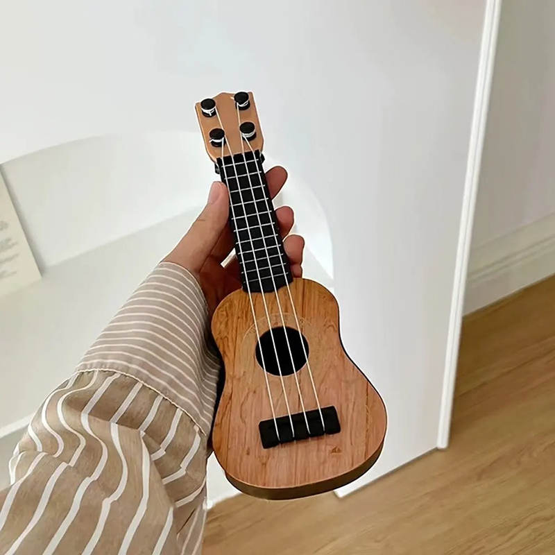 Detailed view of Mini Guitar Ukulele for Kids - Classic Natural Wood Ukulele