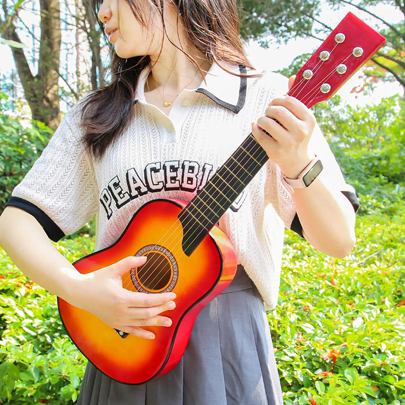Overall view of a 63 cm children's guitar - Sunset