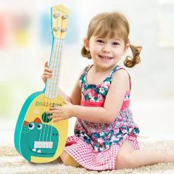 Overall view of the 'Dinosaur Adventures' Safari children's guitar.