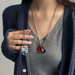 View of the 'Pick & Roll' guitar pendant in red rock style