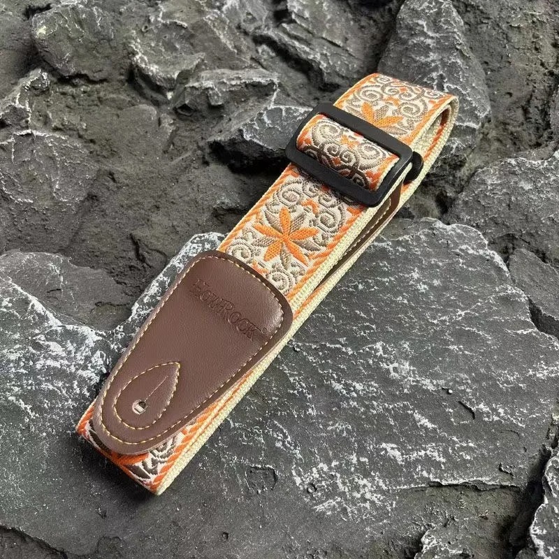 Side view of a vintage guitar strap with a Solar Mandala design.