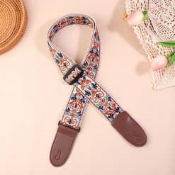 Vintage guitar strap with blue and ochre arabesques