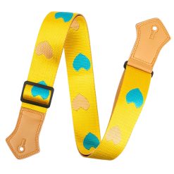 Vintage guitar strap with blue hearts and sand on a yellow background